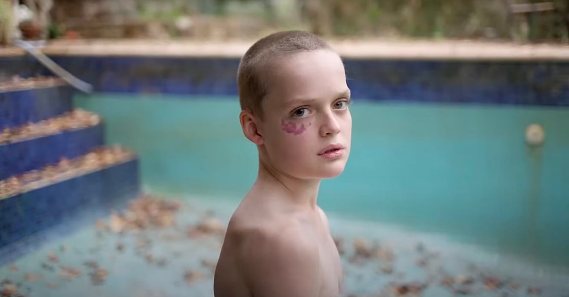 A child stands in an empty pool in a scene from Bring Her Back.