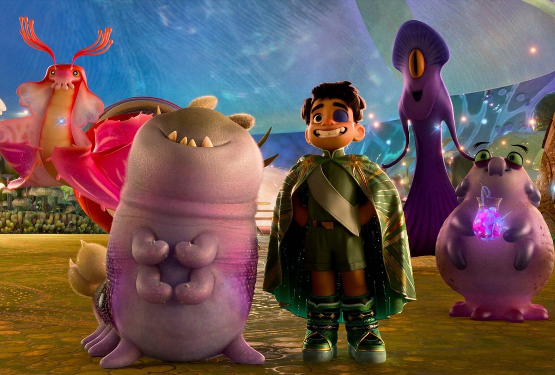 Elio standing with representatives from galaxies far and wide. Among them are Ambassador Tegman (far right), Ambassador Helix (second from right), Ambassador Turais (third from right) and Ambassador Questa (left of Glordon).