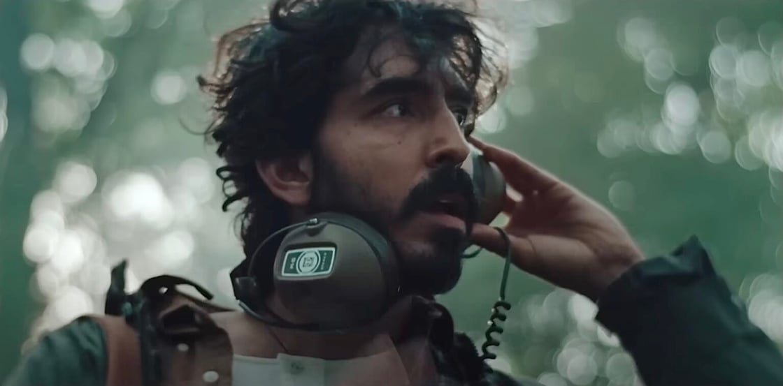 Dev Patel wearing headphones in Rabbit Trap