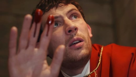 Josh O'Connor as Reverend Jud Duplenticy in Wake Up Dead Man