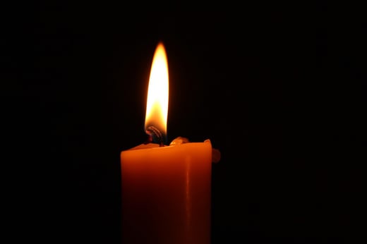 A photograph of a lit candle