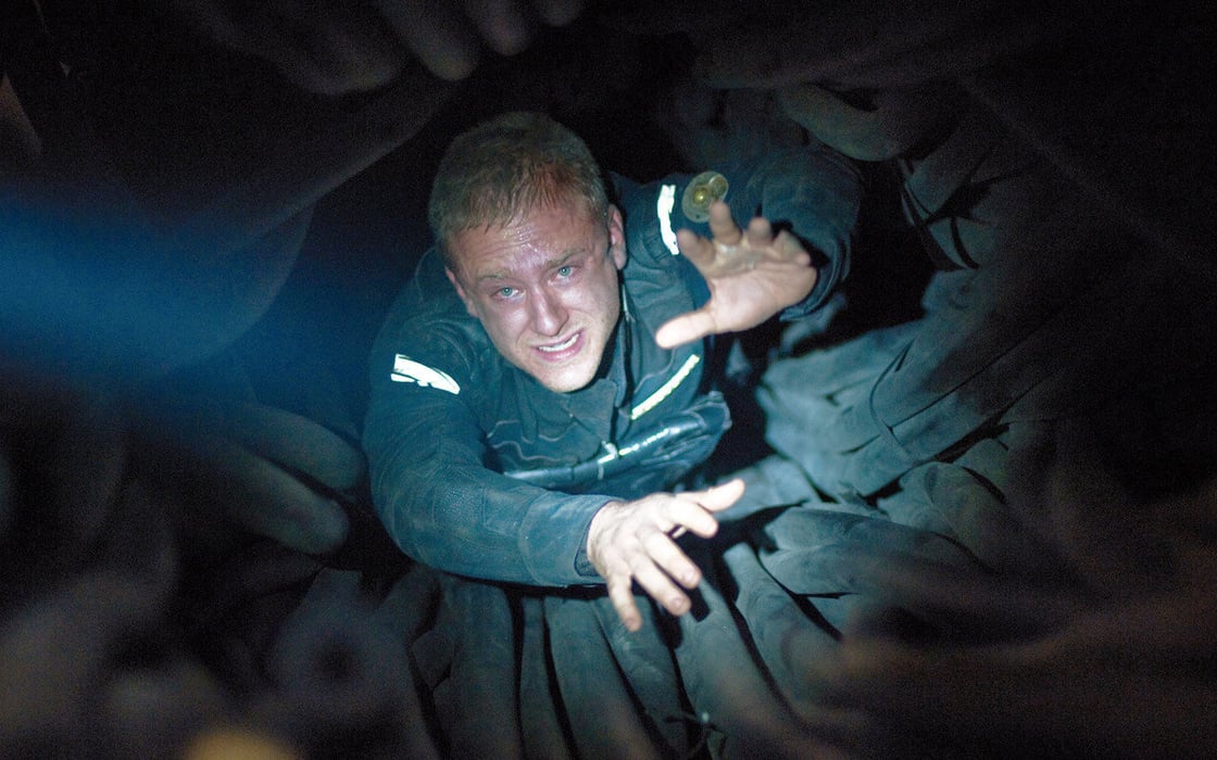 Ben Foster in Pandorum, falling into a whole with one hand outstretched