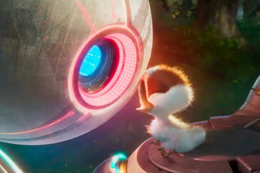 A screencap from The Wild Robot - a duckling touches foreheads with a robot