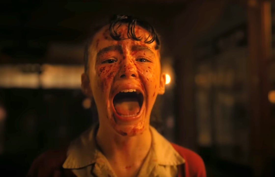 Lilly Bainbridge (Clara Stack) screams in shock after being attacked by a demon baby in It: Welcome to Derry.