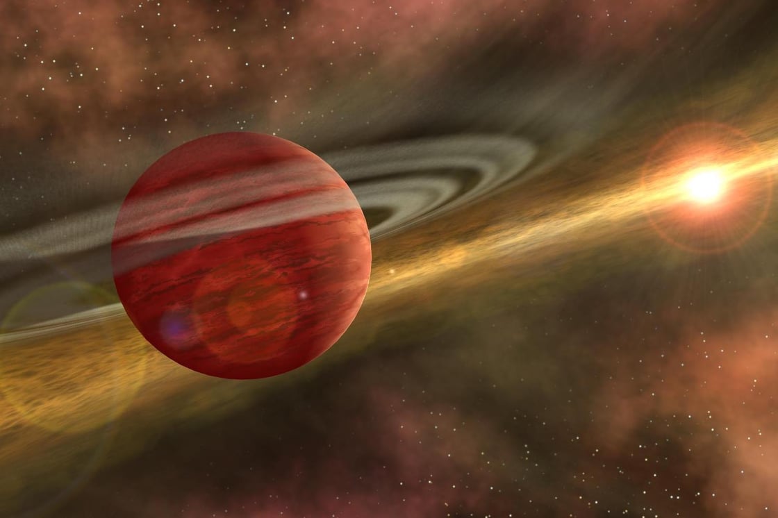 A digital illustration of Saturn and the Sun in the distance