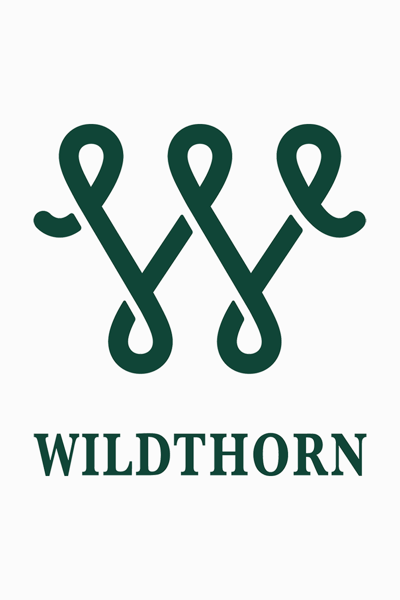The Wildthorn logo, showing looping green lines forming the shape of a W